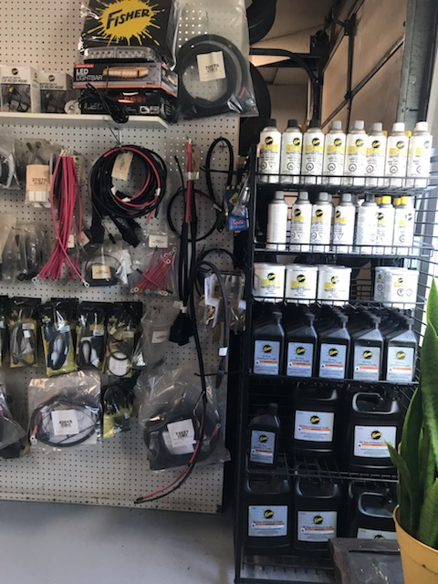 Fisher hydraulic fluid, sprays, and wiring on the parts wall